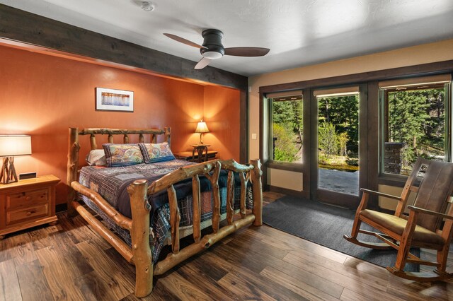 bedroom featuring access to outside, beam ceiling, dark hardwood / wood-style flooring, and ceiling fan