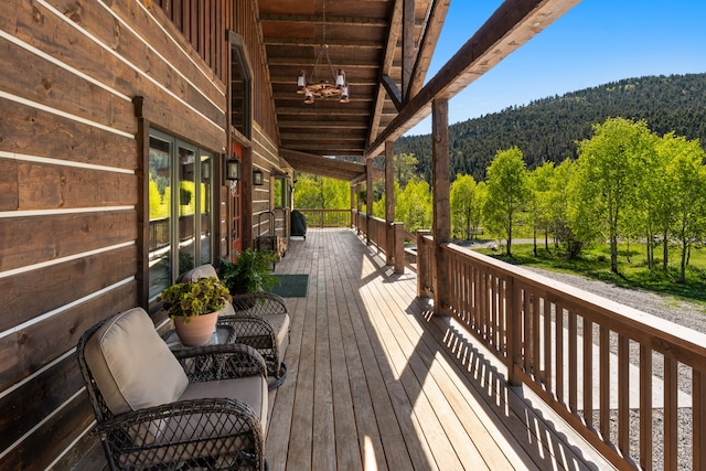 wooden deck featuring a mountain view