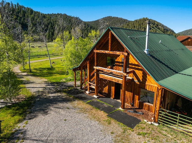 exterior space featuring an outdoor structure and a mountain view