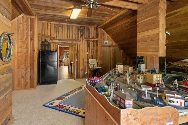 interior space featuring wood ceiling, carpet flooring, vaulted ceiling, wooden walls, and ceiling fan