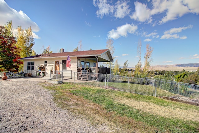 view of front of property featuring a patio