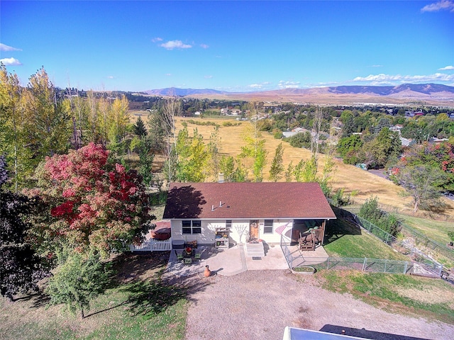 birds eye view of property with a mountain view