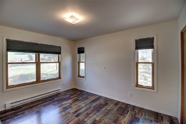 unfurnished room with a baseboard radiator, dark hardwood / wood-style floors, and plenty of natural light