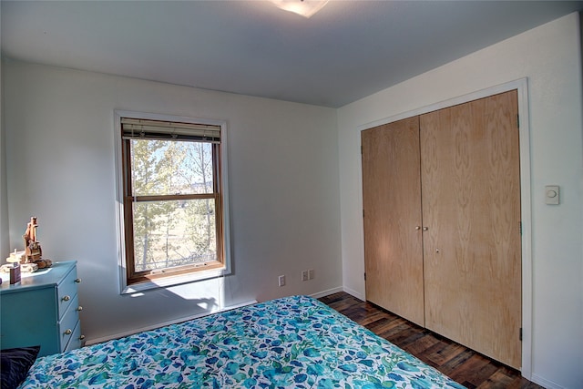 unfurnished bedroom with a closet and dark hardwood / wood-style flooring