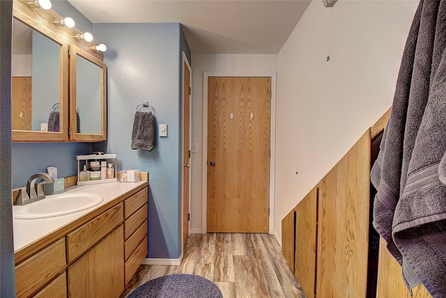 bathroom featuring wood-type flooring and vanity