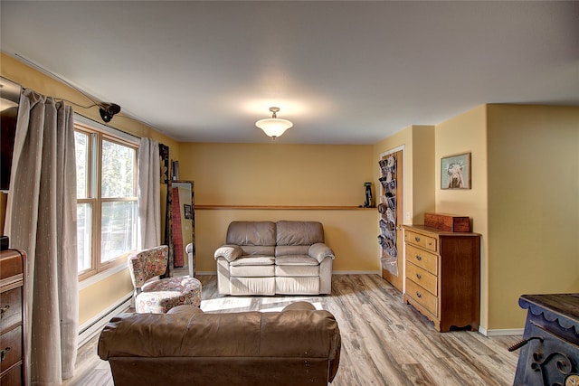 living room featuring a baseboard radiator and light wood-type flooring