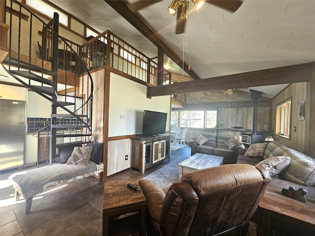 living room with ceiling fan and beamed ceiling