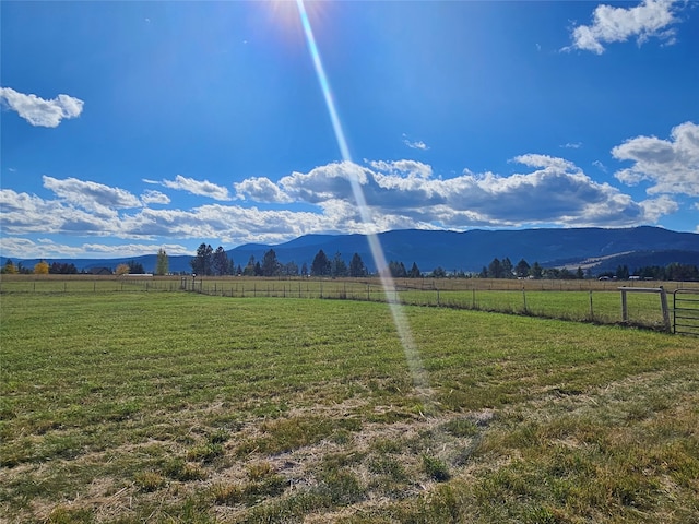 mountain view featuring a rural view