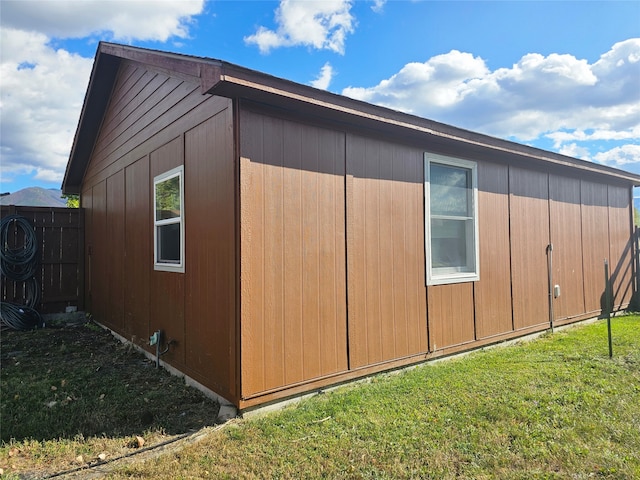 view of side of property featuring a yard