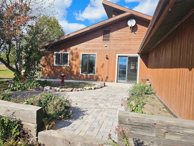 rear view of property with a patio area