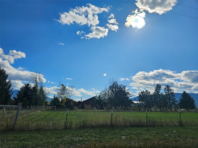 view of yard with a rural view