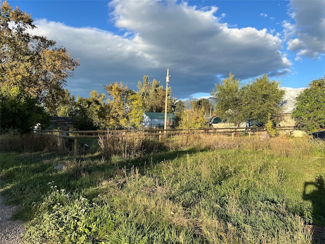 view of yard with a rural view