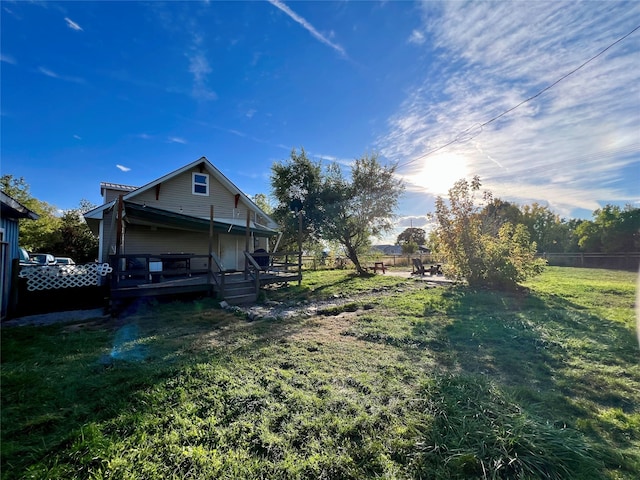 view of yard featuring a wooden deck