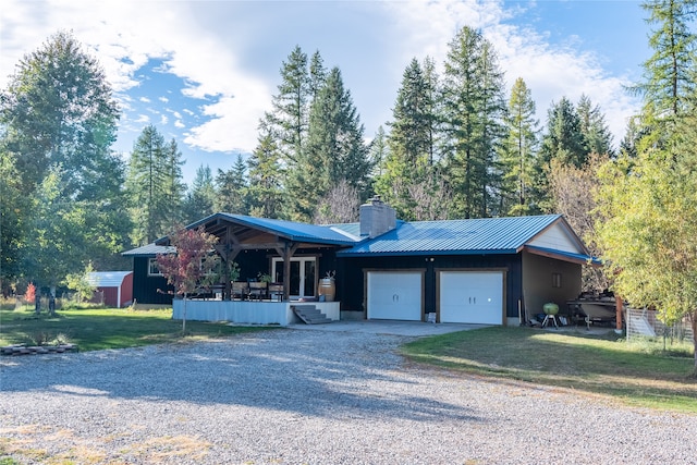 ranch-style house with a front yard and a garage