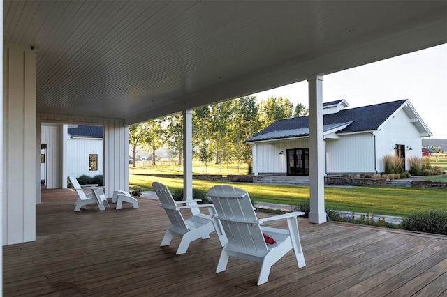 wooden terrace with a yard