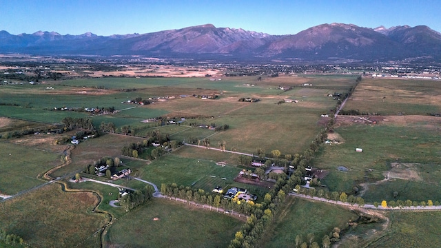 birds eye view of property featuring a mountain view and a rural view