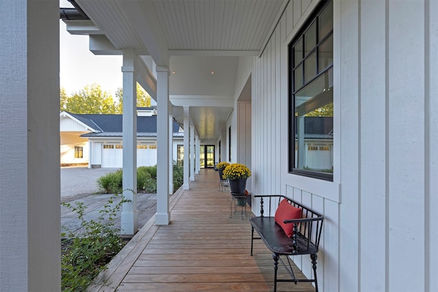 wooden terrace with a porch