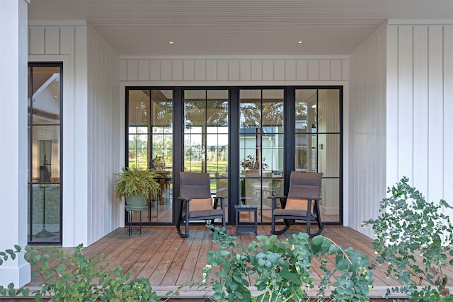 exterior space with wood walls and hardwood / wood-style floors