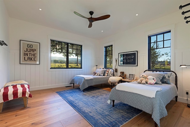 bedroom featuring light hardwood / wood-style floors and ceiling fan