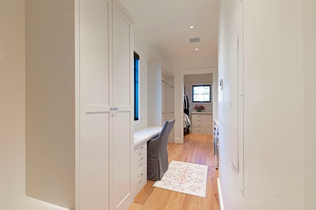 hallway featuring light wood-type flooring