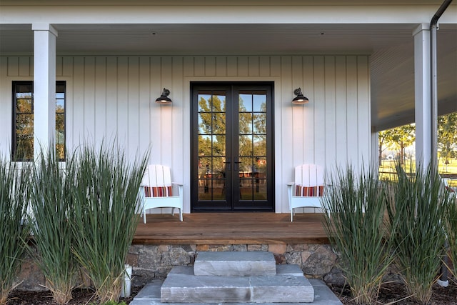 view of exterior entry with covered porch