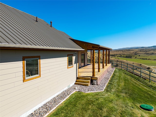 53 Skyview Ln, Townsend, MT 59644 - view of side of property with a standing seam roof, a metal roof, and a wooden deck