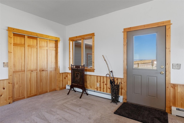 53 Skyview Ln, Townsend, MT 59644 - carpeted entryway with wainscoting, wood walls, and baseboard heating