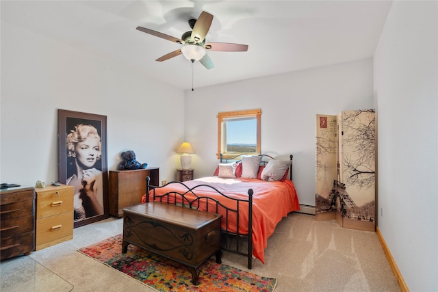 53 Skyview Ln, Townsend, MT 59644 - bedroom with light carpet, a ceiling fan, and a baseboard radiator
