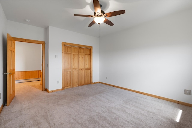 53 Skyview Ln, Townsend, MT 59644 - unfurnished bedroom featuring a baseboard radiator, light colored carpet, a closet, and ceiling fan