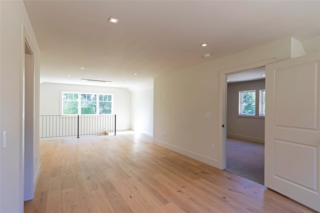 empty room with light hardwood / wood-style flooring