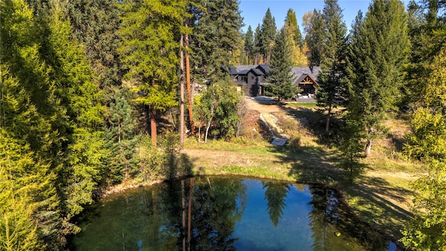 birds eye view of property featuring a water view