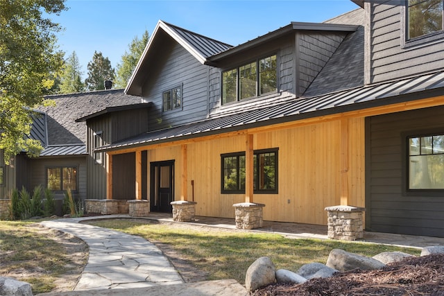 rear view of property featuring a patio area