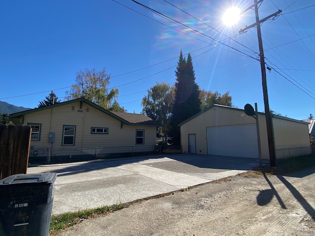 view of side of property with a garage