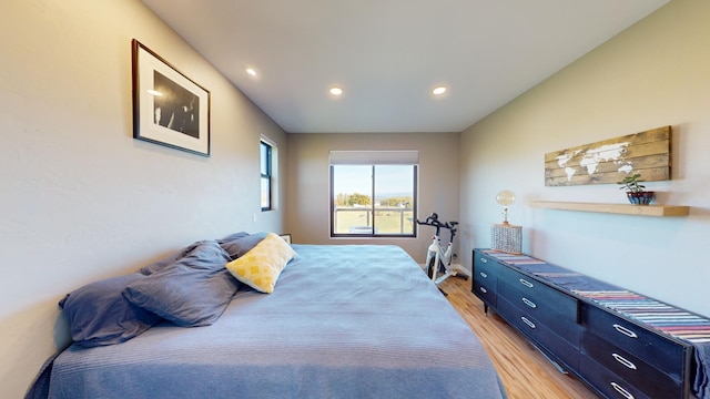 bedroom with light hardwood / wood-style floors