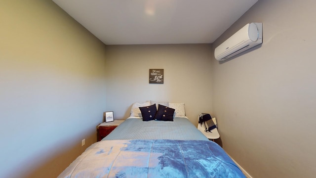 bedroom with an AC wall unit