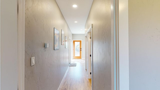 hall with light hardwood / wood-style floors