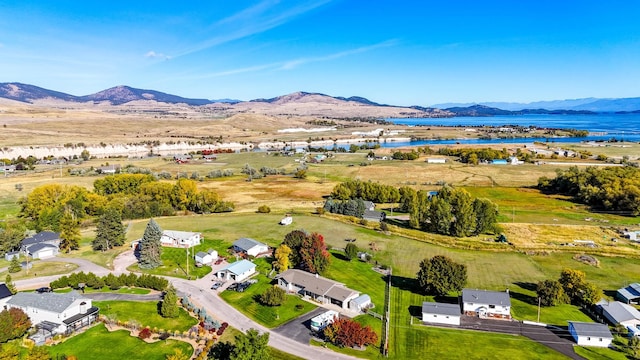 bird's eye view featuring a water and mountain view