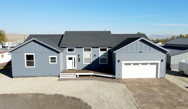 view of front of house with a mountain view and a garage