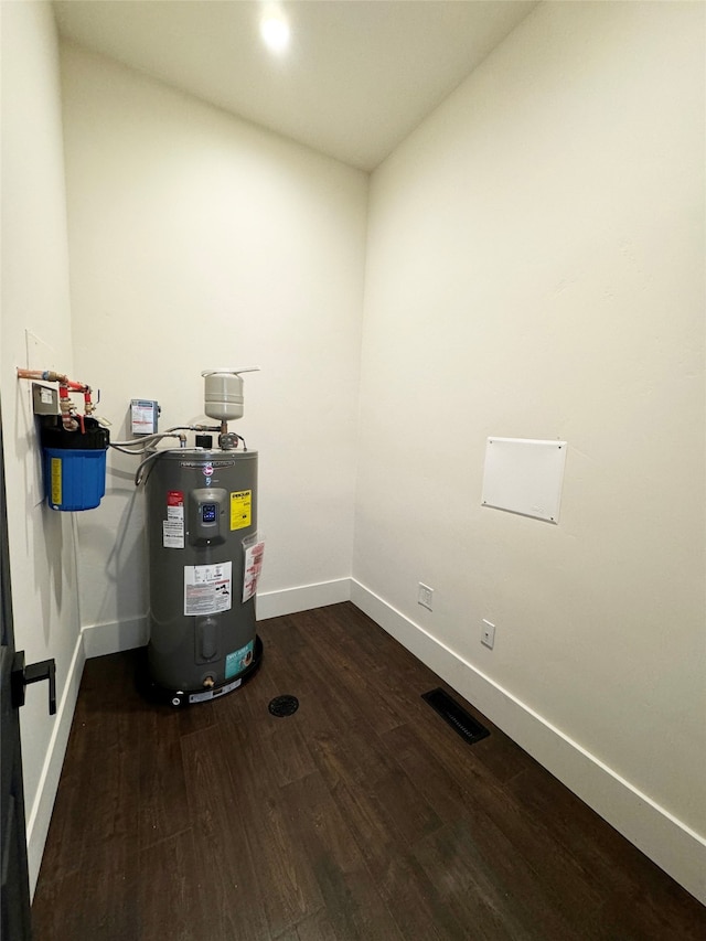 utility room with electric water heater