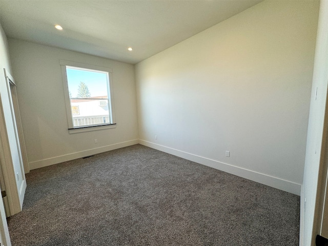 unfurnished bedroom featuring dark colored carpet