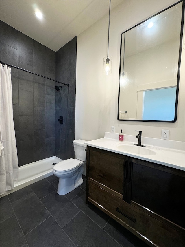 bathroom with vanity, tile patterned floors, toilet, and a shower with shower curtain