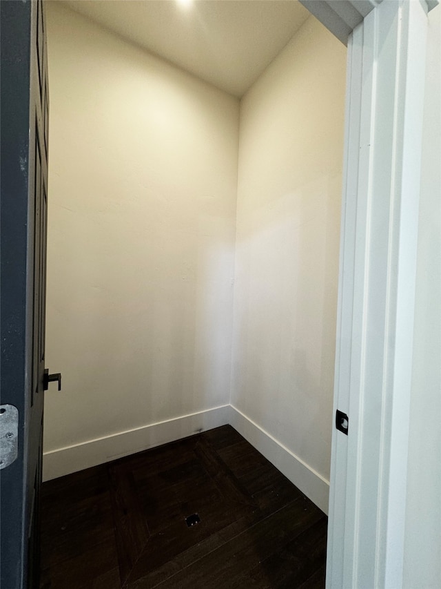 unfurnished room featuring dark wood-type flooring