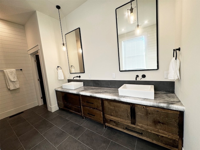 bathroom with tile patterned floors and vanity