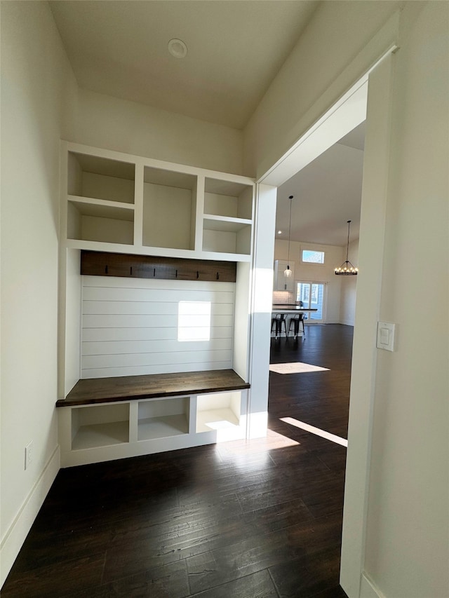 mudroom featuring dark hardwood / wood-style floors and a chandelier