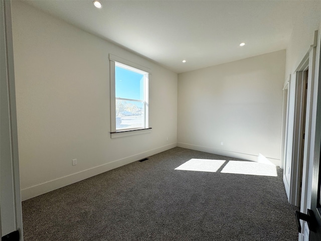 view of carpeted spare room