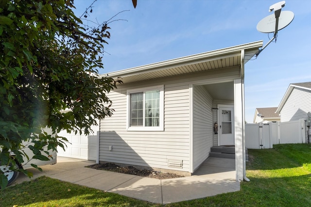 view of home's exterior with a lawn