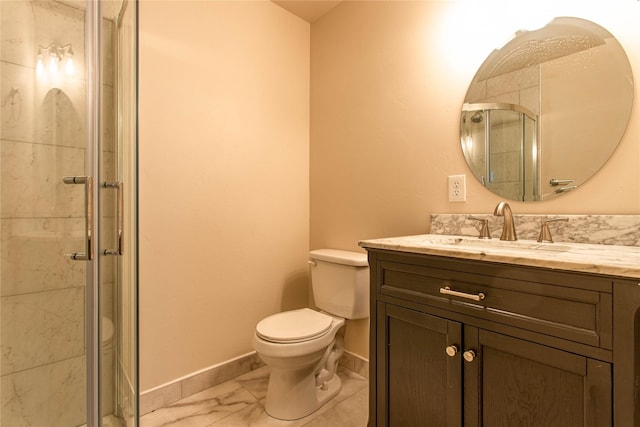 full bath featuring vanity, baseboards, toilet, a shower stall, and marble finish floor