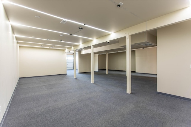 finished basement with carpet flooring, baseboards, and visible vents