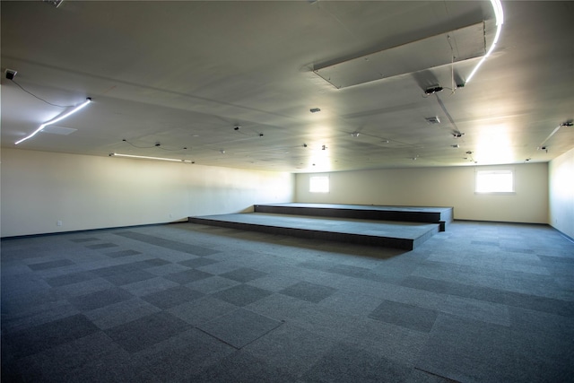 interior space featuring baseboards and carpet flooring
