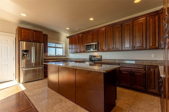 kitchen featuring a center island, appliances with stainless steel finishes, and recessed lighting